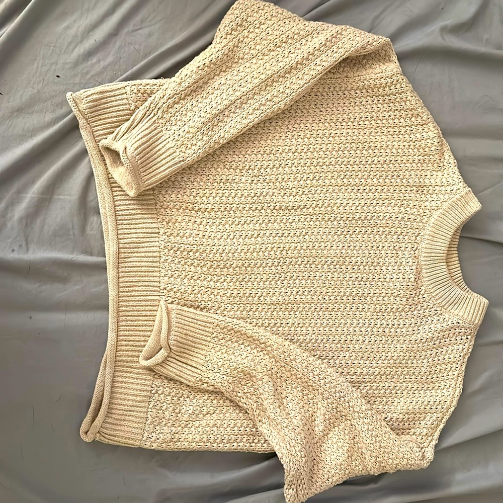 Cream sweater. size Medium.